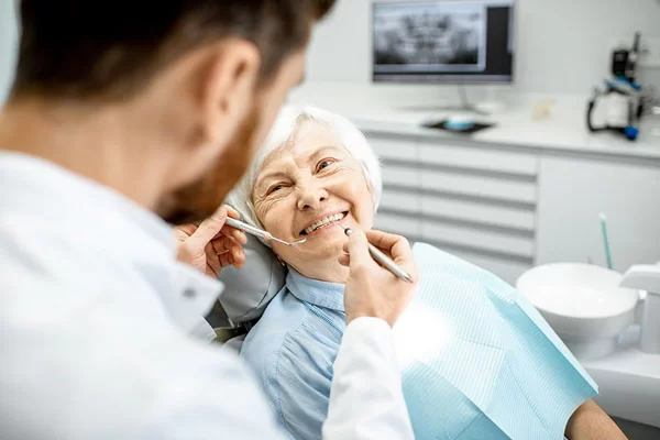 older woman visiting dentist for check-up